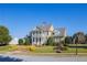 Stately clubhouse with lush lawn, mature trees, and attractive landscaping at 866 Lakemont Dr, Canton, GA 30114