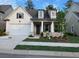 Charming one-story home with a two-car garage and manicured front yard with lovely lawn and beautiful landscaping at 866 Lakemont Dr, Canton, GA 30114