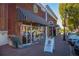A vintage ice cream shop boasts a black and white awning, and seating for customers to enjoy their treats at 866 Lakemont Dr, Canton, GA 30114