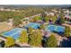 Community tennis courts with mature trees and surrounding residential neighborhood at 866 Lakemont Dr, Canton, GA 30114
