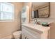Bright bathroom featuring a modern vanity, stylish fixtures, and a well-lit mirror, combining functionality with design at 1472 North Nw Ave, Atlanta, GA 30318