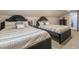 Charming bedroom featuring two stylish beds with elegant headboards and soft, patterned bedding at 1472 North Nw Ave, Atlanta, GA 30318