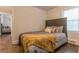 Cozy bedroom featuring a comfortable bed, hardwood floors, and a view into an adjacent room at 1472 North Nw Ave, Atlanta, GA 30318