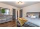Serene bedroom with gray furniture, wood floors, and a window with natural light at 1472 North Nw Ave, Atlanta, GA 30318