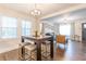 Stylish dining area with modern furnishings and natural light, open to the living room at 1472 North Nw Ave, Atlanta, GA 30318