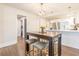 Eat-in kitchen includes a dark wood dining table with seating and a modern chandelier at 1472 North Nw Ave, Atlanta, GA 30318