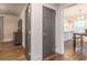 Hallway with hardwood floors leading to kitchen and bedroom areas at 1472 North Nw Ave, Atlanta, GA 30318