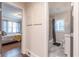 Hallway view leading to a bedroom and bathroom, showcasing hardwood floors and stylish interior design elements at 1472 North Nw Ave, Atlanta, GA 30318