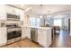 Modern kitchen with stainless steel appliances, white cabinetry, and stylish countertops at 1472 North Nw Ave, Atlanta, GA 30318