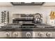 Stainless steel stove and range with five burners, spice rack, and white countertop at 1472 North Nw Ave, Atlanta, GA 30318