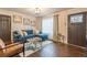 Bright living room featuring a stylish blue sofa and modern decor at 1472 North Nw Ave, Atlanta, GA 30318