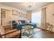 Cozy living room with a plush blue sofa, decorative art, and natural light at 1472 North Nw Ave, Atlanta, GA 30318