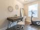 Home office with modern desk, exercise bike, and natural lighting at 1472 North Nw Ave, Atlanta, GA 30318