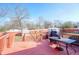 Outdoor wooden deck overlooking the backyard with a table and grill at 1724 Hill Ne St, Conyers, GA 30012