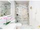 Modern bathroom with glass-enclosed shower, sleek vanity, and marble-style tiling on floors and shower walls at 1724 Hill Ne St, Conyers, GA 30012