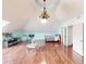 Spacious bonus room with wood floors, modern lighting, and plenty of space for entertaining and relaxation at 1724 Hill Ne St, Conyers, GA 30012