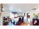 Bright dining room featuring hardwood floors, stone accents, and open access to the kitchen at 1724 Hill Ne St, Conyers, GA 30012