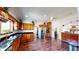 Large kitchen with stainless appliances, stone countertops, and lots of cabinet storage at 1724 Hill Ne St, Conyers, GA 30012
