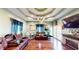 Spacious living room with recessed lighting, chandelier, stone fireplace, and hardwood floors at 1724 Hill Ne St, Conyers, GA 30012