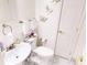 Elegant powder room with marble floors, modern fixtures, and butterfly wall decor at 1724 Hill Ne St, Conyers, GA 30012