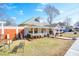 Lovely side view of home with manicured lawn and mature trees, great for outdoor living at 1724 Hill Ne St, Conyers, GA 30012