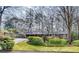 Charming single-story home with a brick facade, manicured landscaping, and a curved driveway at 2356 Sherbrooke Ne Dr, Atlanta, GA 30345