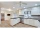 Bright kitchen featuring white cabinetry, stainless steel appliances, and an adjacent breakfast nook at 2356 Sherbrooke Ne Dr, Atlanta, GA 30345