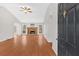 Open living room featuring beautiful wood floors, a fireplace, and plenty of natural light at 305 Sadler Dr, Douglasville, GA 30134