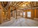 Unfinished basement featuring wood framing, utilities, and concrete flooring at 1363 Summer Lane Se Dr, Atlanta, GA 30316
