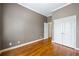 Bedroom with hardwood floors, gray walls, white trim, and closet at 1363 Summer Lane Se Dr, Atlanta, GA 30316