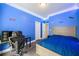 Bright bedroom featuring LED lights, a bed, carpet flooring, and a desk at 1363 Summer Lane Se Dr, Atlanta, GA 30316