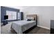 Cozy bedroom with gray walls, a bed with a wood headboard, a wardrobe, and a window at 1363 Summer Lane Se Dr, Atlanta, GA 30316