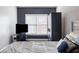Bedroom with a bed, blue accent wall, and closet providing ample storage at 1363 Summer Lane Se Dr, Atlanta, GA 30316