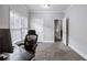 Bright room with gray walls, a desk and an open door, and a rolling office chair at 1363 Summer Lane Se Dr, Atlanta, GA 30316