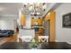 Bright dining area with chandelier, open to the kitchen and living room at 1363 Summer Lane Se Dr, Atlanta, GA 30316