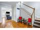 Elegant foyer features hardwood floors, staircase, and entry to the living room with fireplace at 1363 Summer Lane Se Dr, Atlanta, GA 30316