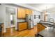 Well-lit kitchen features wooden cabinets, stainless steel appliances, granite countertops and a door to the bathroom at 1363 Summer Lane Se Dr, Atlanta, GA 30316