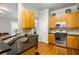 Modern kitchen with stainless steel appliances, granite countertops, and wood cabinets at 1363 Summer Lane Se Dr, Atlanta, GA 30316