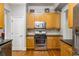 Modern kitchen with stainless steel appliances, granite countertops, and wood cabinets at 1363 Summer Lane Se Dr, Atlanta, GA 30316