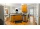 Well-lit kitchen features wooden cabinets, stainless steel appliances, granite countertops and an opening to living room at 1363 Summer Lane Se Dr, Atlanta, GA 30316