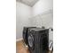 Laundry room featuring side-by-side washer and dryer and wire shelving at 1363 Summer Lane Se Dr, Atlanta, GA 30316