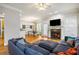 Open living space featuring a fireplace, hardwood floors, and view of the dining area at 1363 Summer Lane Se Dr, Atlanta, GA 30316