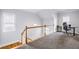 Loft area features carpeted floors, two windows, and a desk, creating a comfortable workspace at 1363 Summer Lane Se Dr, Atlanta, GA 30316