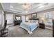Spacious main bedroom features carpeted floors, a tray ceiling, and large windows for natural light at 1363 Summer Lane Se Dr, Atlanta, GA 30316