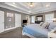 Spacious main bedroom features carpeted floors, a tray ceiling, and large windows for natural light at 1363 Summer Lane Se Dr, Atlanta, GA 30316