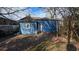 Backyard view of a blue home with a white door and window at 884 Mcdaniel Sw St, Atlanta, GA 30310