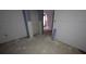 Unfinished hallway with drywall and doorway leading to another space at 884 Mcdaniel Sw St, Atlanta, GA 30310