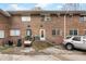 Backyard exterior featuring a brick wall, doors, windows, stairwells and a parked car at 2412 Peachwood Circle Northeast Ne Cir # 3, Atlanta, GA 30345