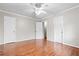 Spacious bedroom featuring hardwood floors, a ceiling fan, and ample natural light at 2412 Peachwood Circle Northeast Ne Cir # 3, Atlanta, GA 30345