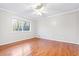 Bedroom with hardwood floors, a ceiling fan, and large window providing a lot of natural light at 2412 Peachwood Circle Northeast Ne Cir # 3, Atlanta, GA 30345